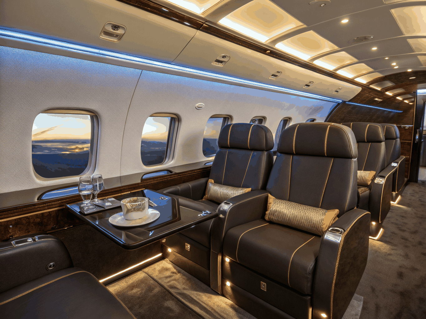 Private jet cabin interior with gold accents
